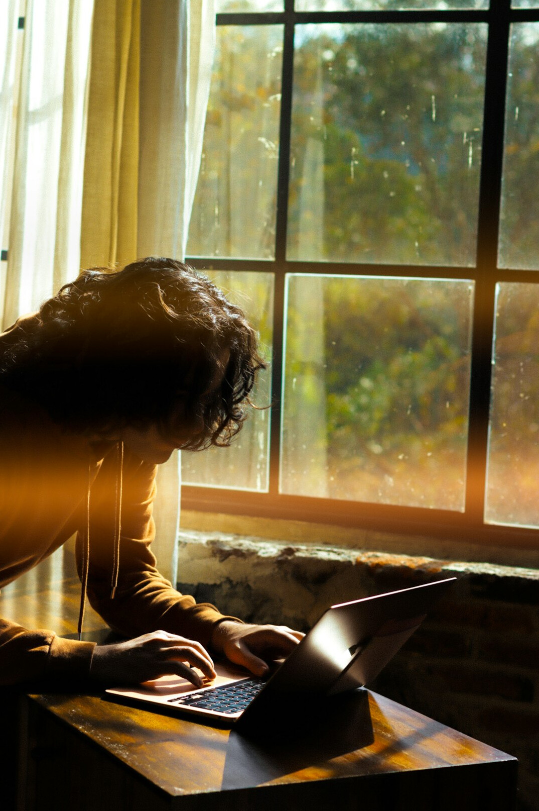 woman writing thriller novel at desk