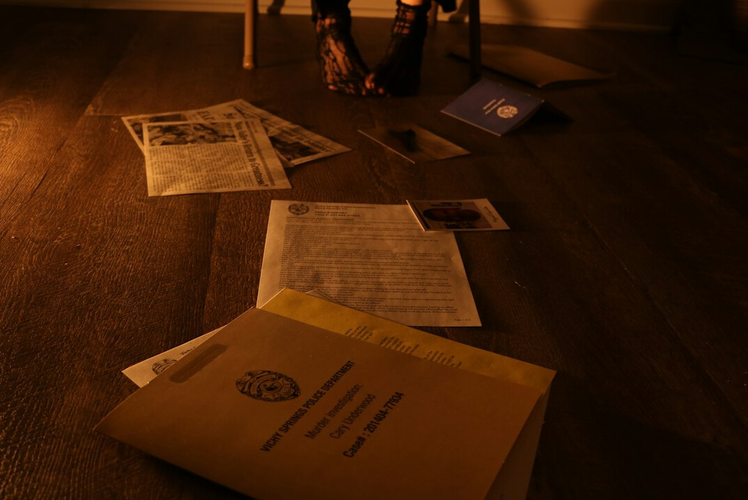 detective examining evidence at crime scene