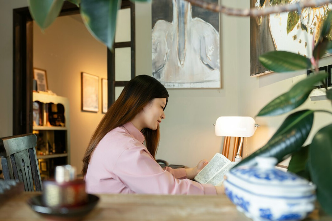 woman writing thriller novel at desk